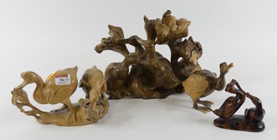 Lot 56 - A Balinese polished wooden figure carved as...