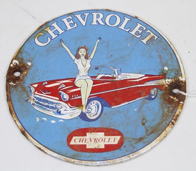 Lot 43 - A circular enamel on metal advertising sign...