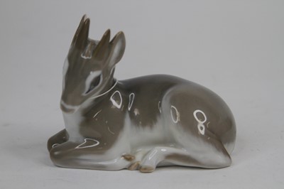 Lot 55 - A Royal Copenhagen porcelain model of a fawn,...