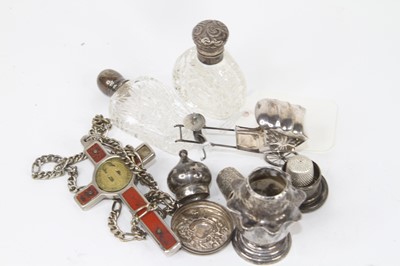 Lot 272 - A white metal model of a man pulling a...