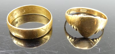 Lot 329 - An 18ct gold wedding band, size O; together...
