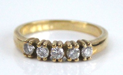 Lot 2622 - A yellow metal diamond half eternity ring,...