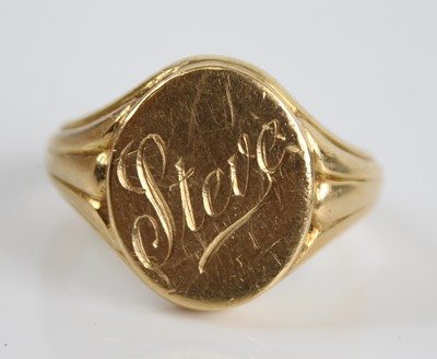 Lot 2427 - A yellow metal gent's signet ring, the oval...