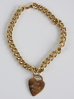 Lot 2429 - A yellow metal heavy curblink bracelet, having...