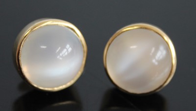 Lot 2438 - A pair of yellow metal cabochon moonstone set...