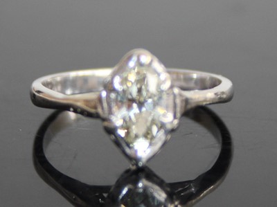 Lot 2433 - A platinum and diamond single stone ring, the...