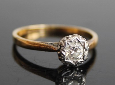 Lot 2435 - An 18ct gold diamond solitaire ring, the...