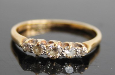 Lot 2436 - An 18ct gold and platinum diamond half hoop...