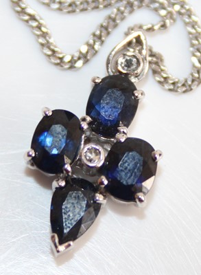 Lot 2469 - A white metal, sapphire and diamond point set...