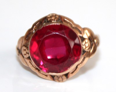 Lot 2471 - A yellow metal and synthetic ruby set dress...