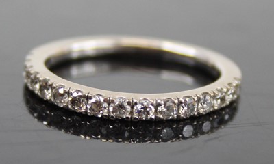Lot 2462 - A contemporary 18ct white gold diamond half...