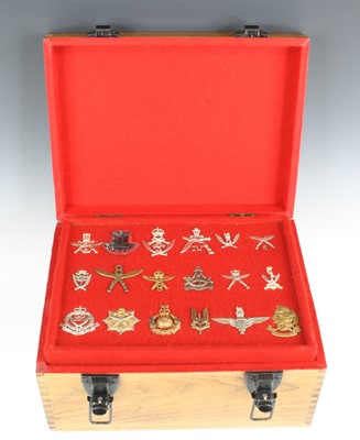 Lot 771 - A large collection of cap badges, to include...