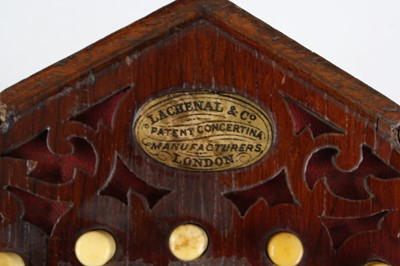 Lot 683 - A late Victorian concertina, of typical...