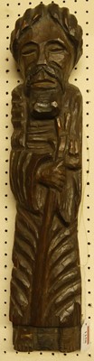 Lot 1158 - A crude chip-carved oak wall hanging, modelled...
