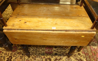 Lot 1421 - A rustic Victorian stained pine drop flap...