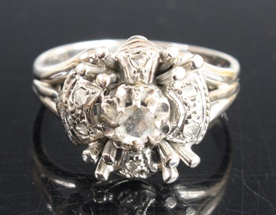 Lot 367 - A white metal diamond dress ring arranged as a...
