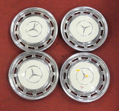 Lot 546 - A set of four Mercedes chrome hubcaps, each...