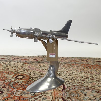 Lot 1252 - A cast and polished aluminium freestanding...