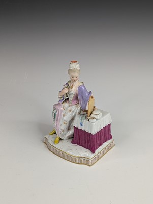 Lot 2066 - A Meissen porcelain figure of a lady sat at...