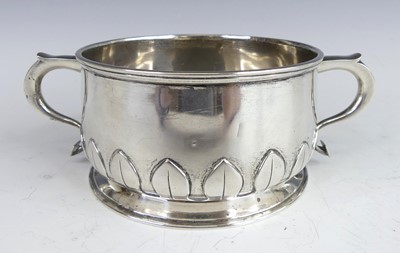 Lot 141 - An Art Deco silver twin handled porringer, of...