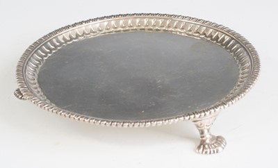 Lot 2185 - An early George III silver card waiter, having...