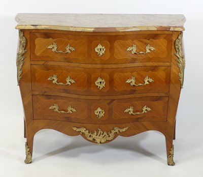 Lot 1303 - A walnut bombe commode in the Louis XV style,...