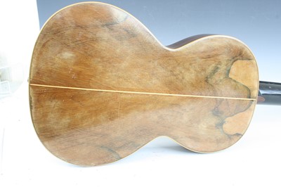 Lot 656 - An acoustic parlour guitar having a walnut...
