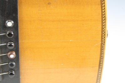 Lot 656 - An acoustic parlour guitar having a walnut...