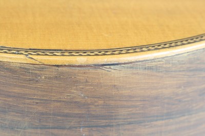 Lot 656 - An acoustic parlour guitar having a walnut...