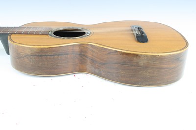 Lot 656 - An acoustic parlour guitar having a walnut...