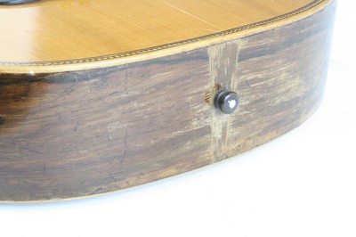 Lot 656 - An acoustic parlour guitar having a walnut...