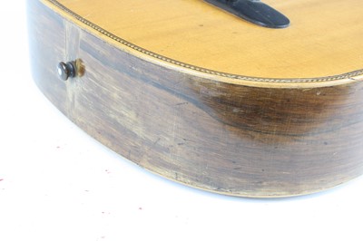 Lot 656 - An acoustic parlour guitar having a walnut...