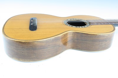 Lot 656 - An acoustic parlour guitar having a walnut...