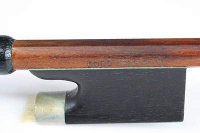 Lot 667 - A violin bow having a nickel adjustor with...