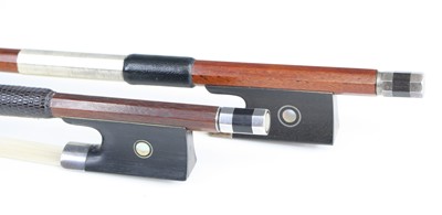 Lot 647 - An unmarked violin bow having white metal and...