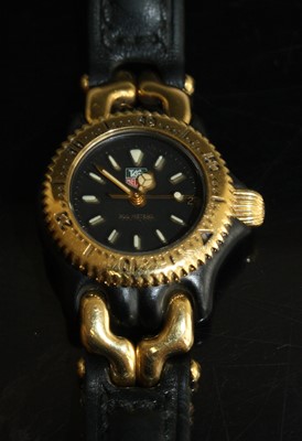 Lot 270 - A lady's Tag Heuer quartz wristwatch S93.308C...