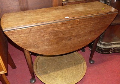Lot 1347 - A 19th century mahogany drop-flap supper table,...