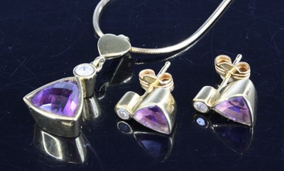 Lot 2573 - A yellow metal, amethyst and diamond pendant...