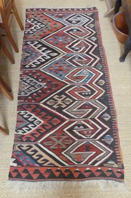 Lot 1261 - A Persian woollen Kelim rug, decorated with...