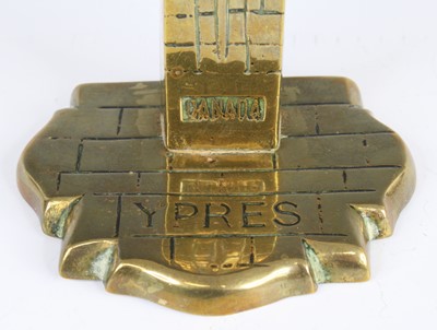 Lot 603 - A post WW I brass desk weight in the form of...