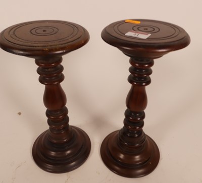 Lot 21 - A pair of turned hardwood stands, h.27cm
