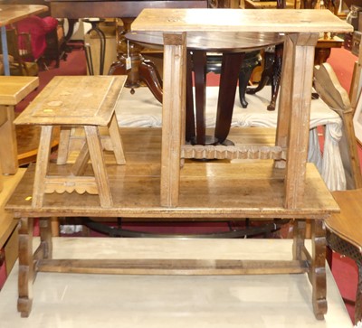 Lot 1297 - A Columbian provincial walnut plank top bench...