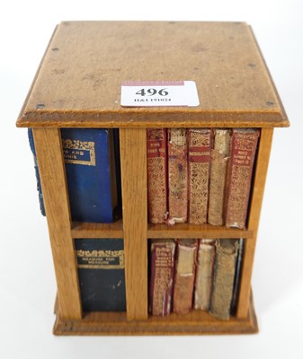 Lot 406 - A miniature oak revolving bookcase, containing...
