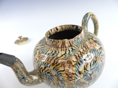 Lot 2069 - A Staffordshire agateware teapot, circa 1755,...