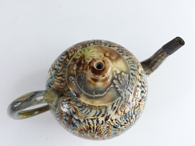 Lot 2069 - A Staffordshire agateware teapot, circa 1755,...