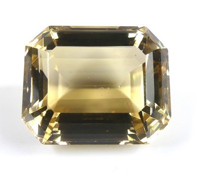 Lot 412 - A loose rectangular faceted citrine, measuring...