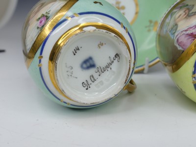 Lot 2098 - A set of three Vienna porcelain tea cups and...