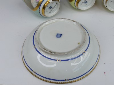 Lot 2098 - A set of three Vienna porcelain tea cups and...