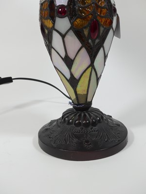 Lot 15 - A Tiffany style table lamp, having a stained...