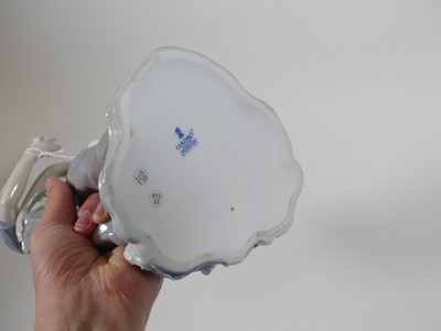 Lot 22 - A Lladro porcelain figure group of a courting...